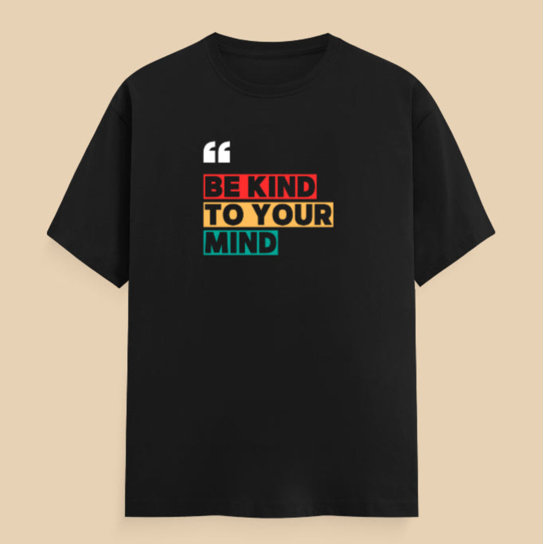 Black t-shirt with 'Be Kind to Your Mind' text on a beige background