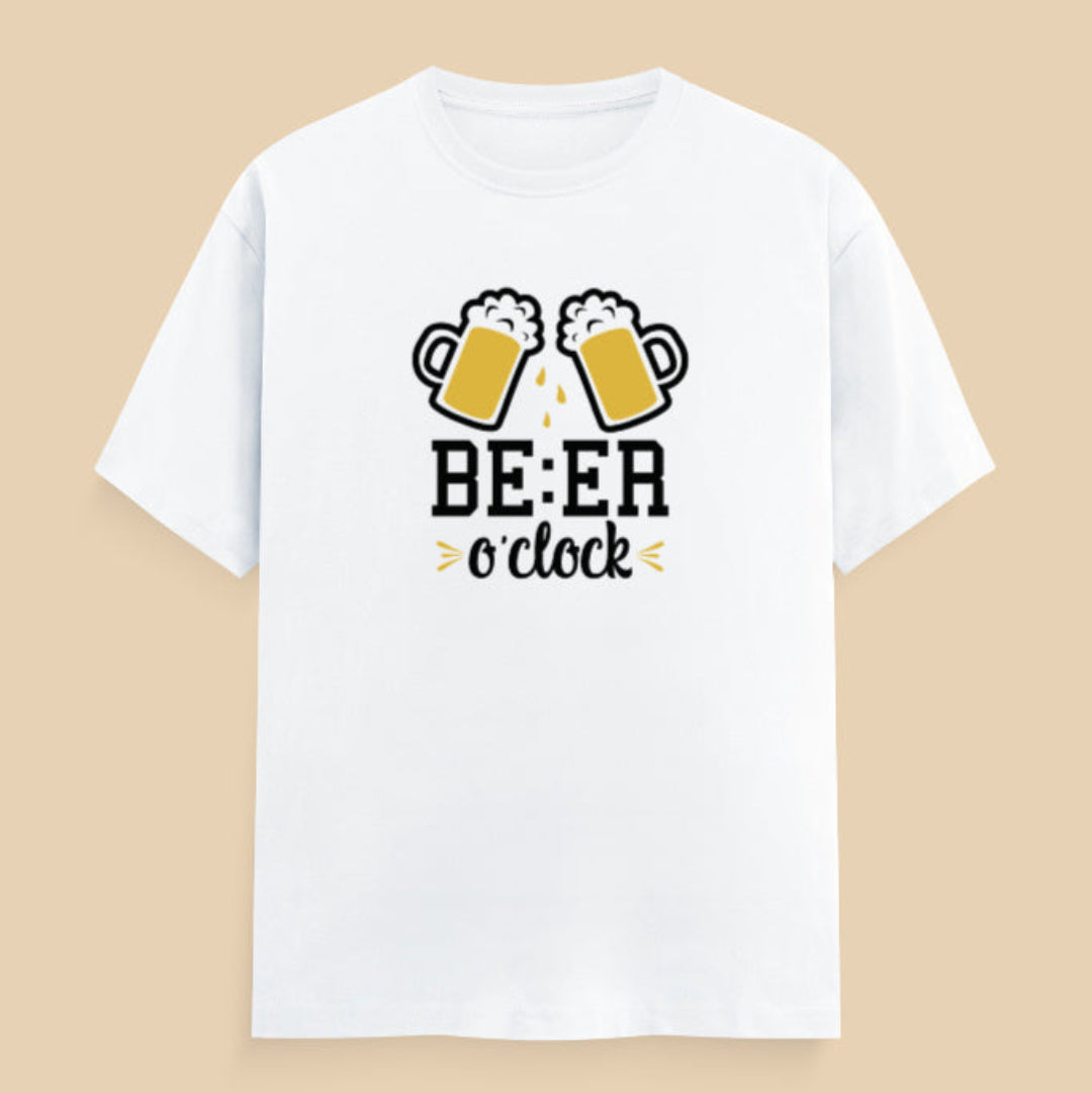 White t-shirt with beer-themed design on a wooden surface