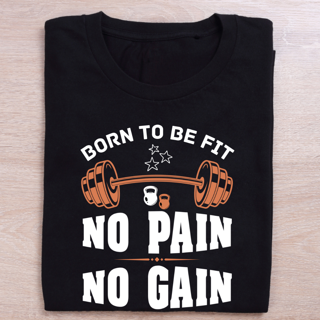 Black t-shirt with fitness-themed text and graphics on a wooden surface