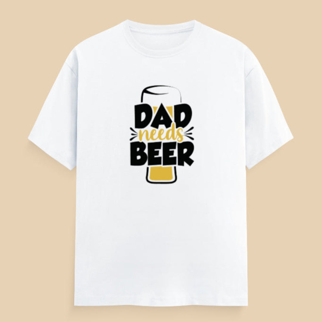 White t-shirt with 'Dad needs Beer' text on a flat surface