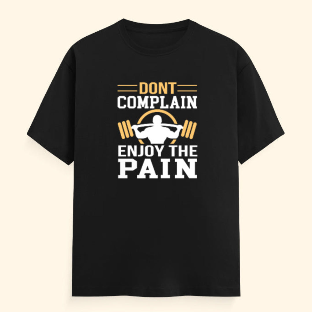 Black t-shirt with motivational graphic and text on a beige background