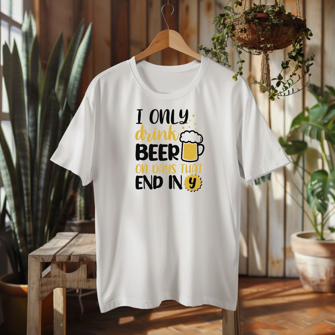 White t-shirt with humorous text design on a hanger in a home setting
