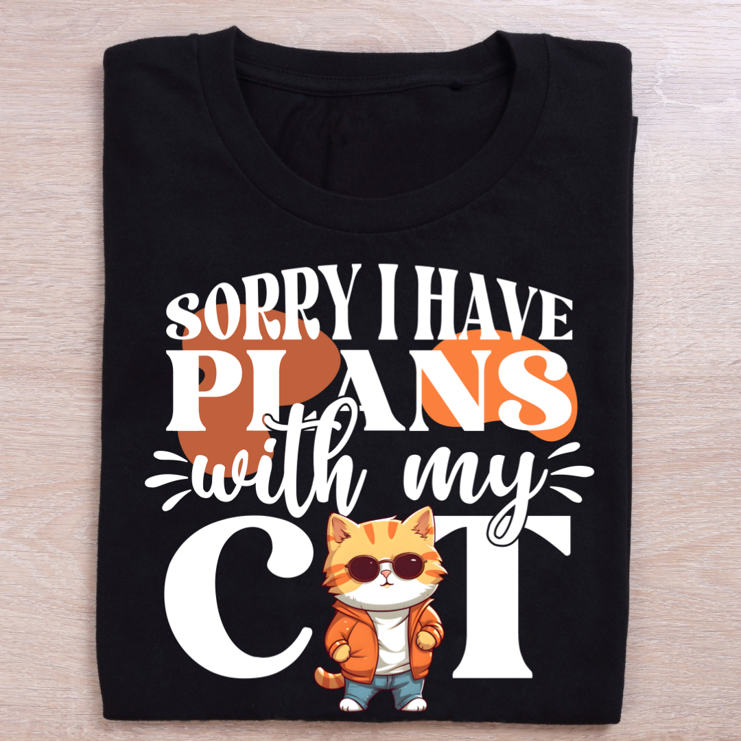 Black t-shirt with a cat graphic and text on the t-shirt