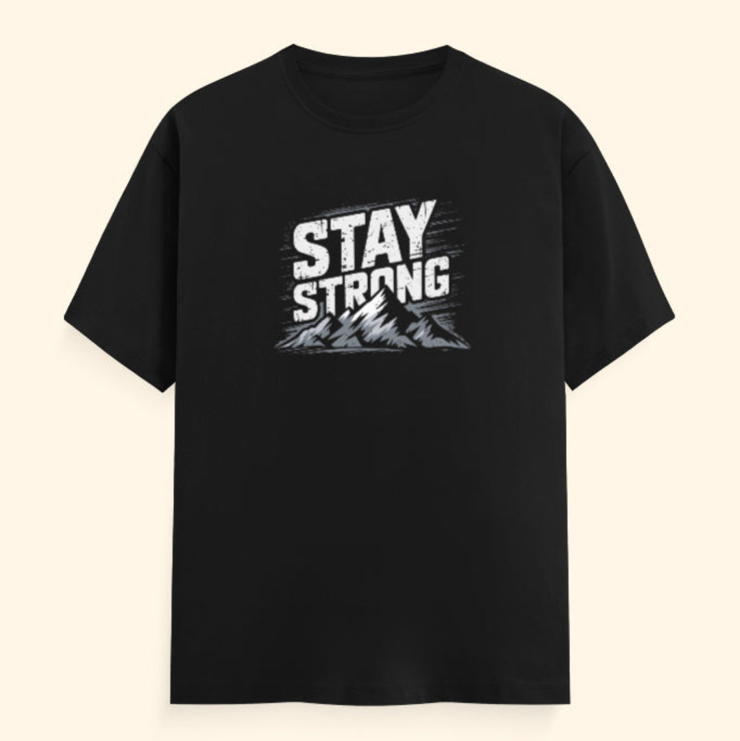 Black t-shirt with 'Stay Strong' text on a beige background