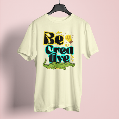 Light-colored t-shirt with 'Be Creative' text and alligator graphic on a pink background