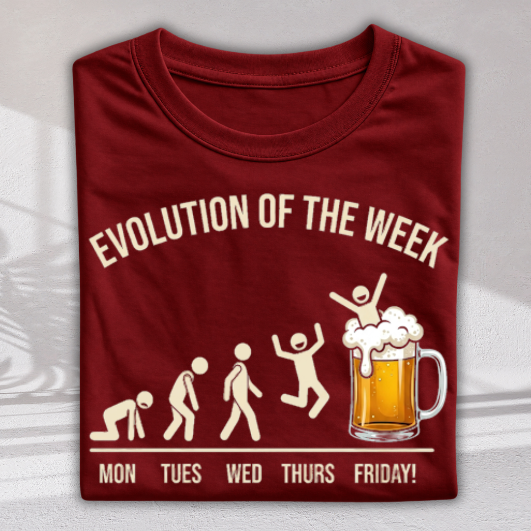 A folded maroon crewneck t-shirt with a graphic print that reads 'EVOLUTION OF THE WEEK' and 'MON TUES WED THURS FRIDAY!'. The graphic shows a beer mug with a celebrating figure on top, replacing the traditional human evolution sequence.