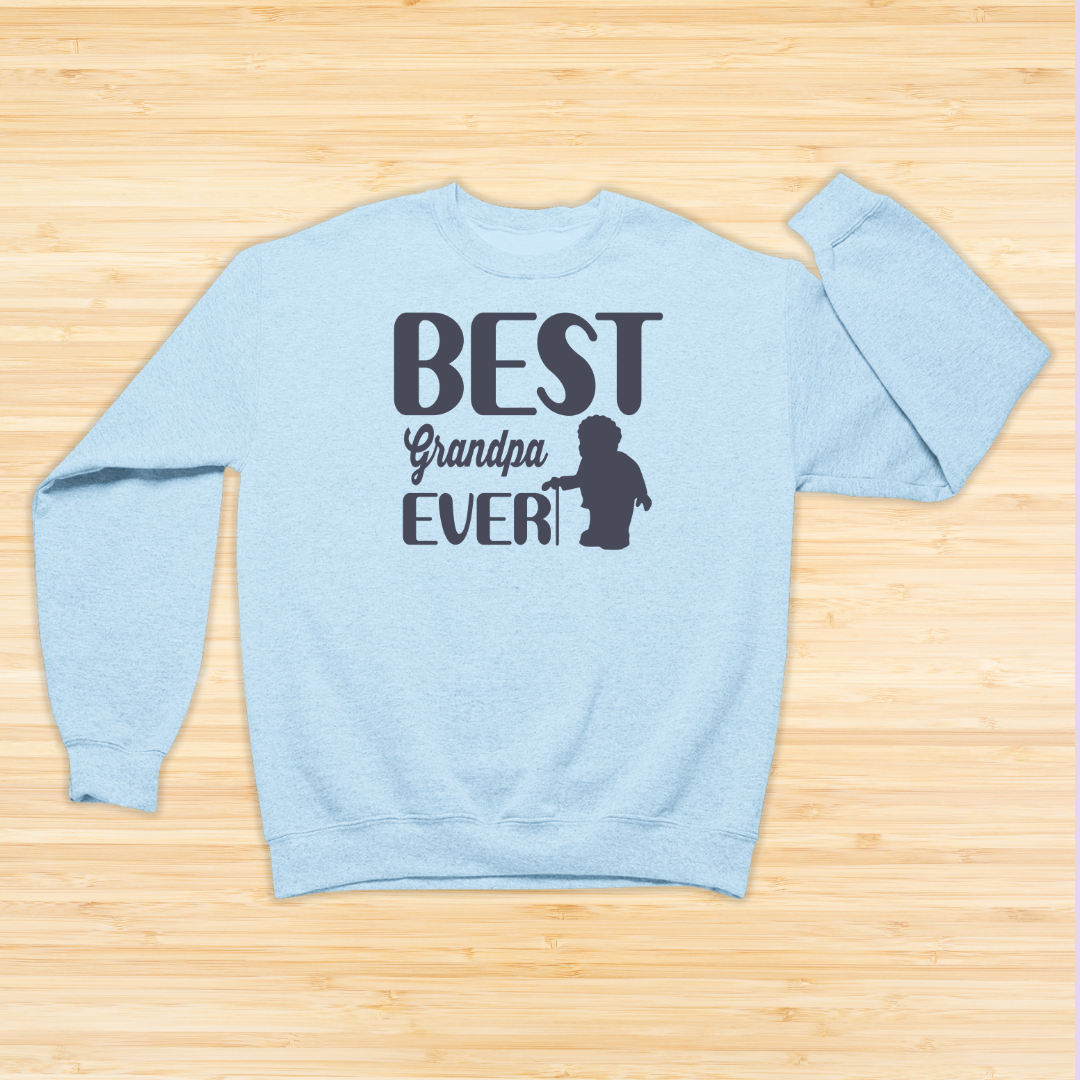 Light blue sweatshirt with 'Best Grandpa Ever' text on a wooden surface