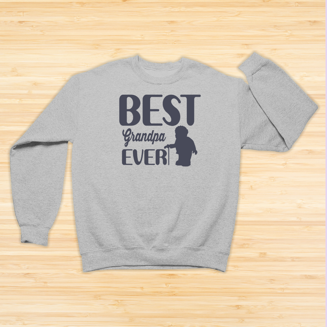 Gray sweatshirt with 'Best Grandpa Ever' text on a wooden surface
