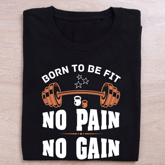 Black t-shirt with fitness-themed text and graphics on a wooden surface