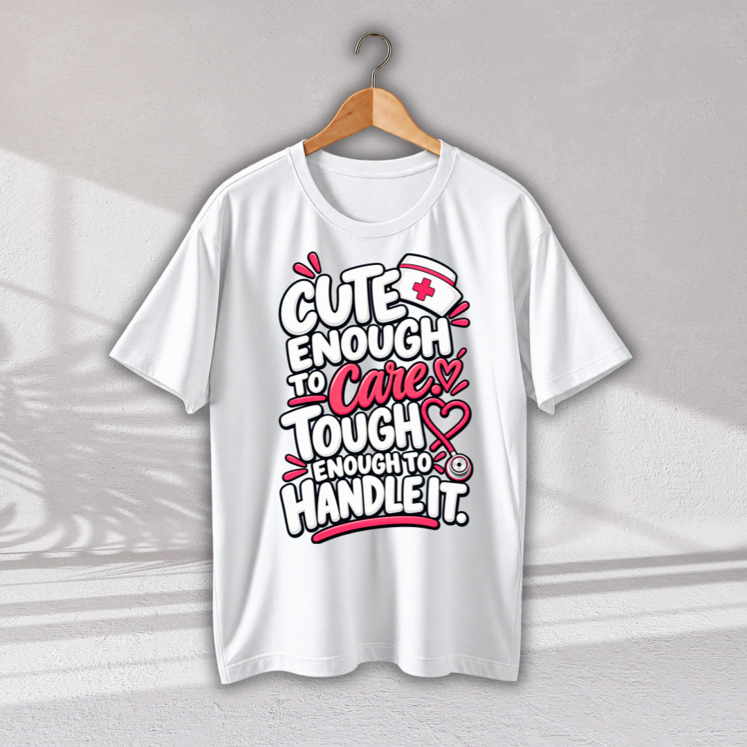 A white short-sleeve graphic T-shirt hanging on a wooden hanger against a light gray wall. The shirt features a bold text graphic reading 'CUTE ENOUGH TO Care TOUGH ENOUGH TO HANDLE IT.