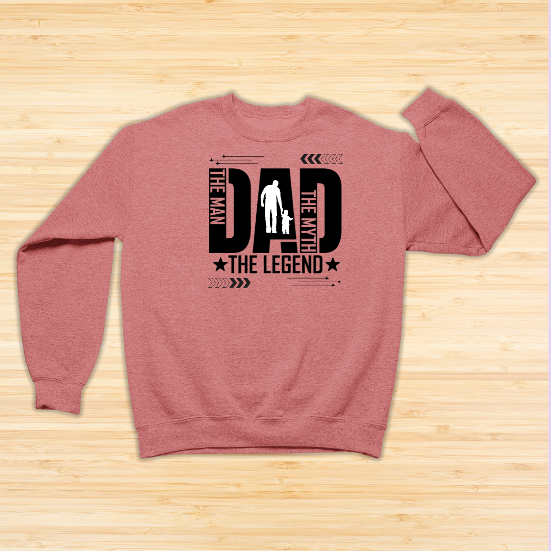 Coral sweatshirt with black text design on a wooden surface