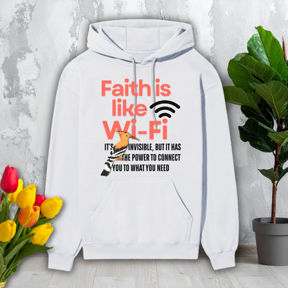 White hoodie with motivational text and graphics on a light gray surface with flowers and a plant.