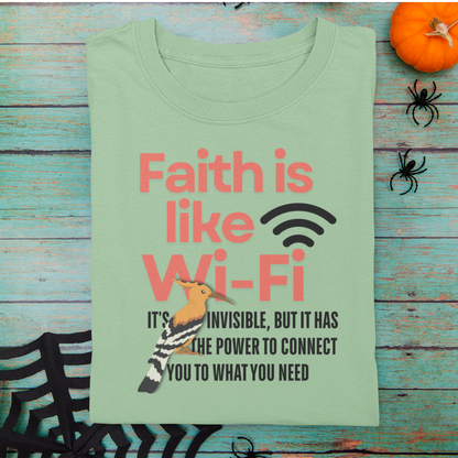 Light green t-shirt with humorous text design on a wooden surface with Halloween decorations.