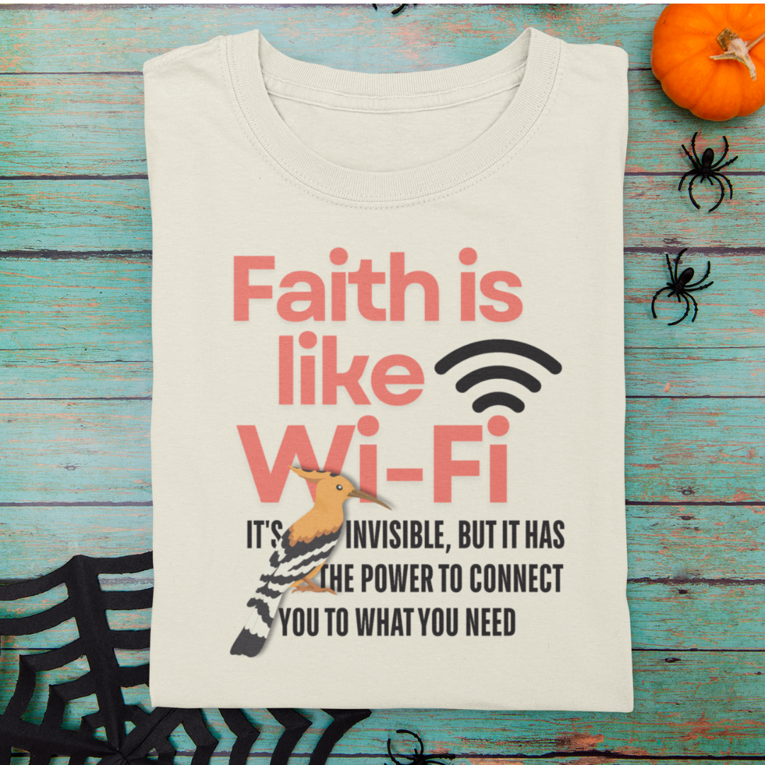 Beige t-shirt with motivational quote on a wooden surface with Halloween decorations.