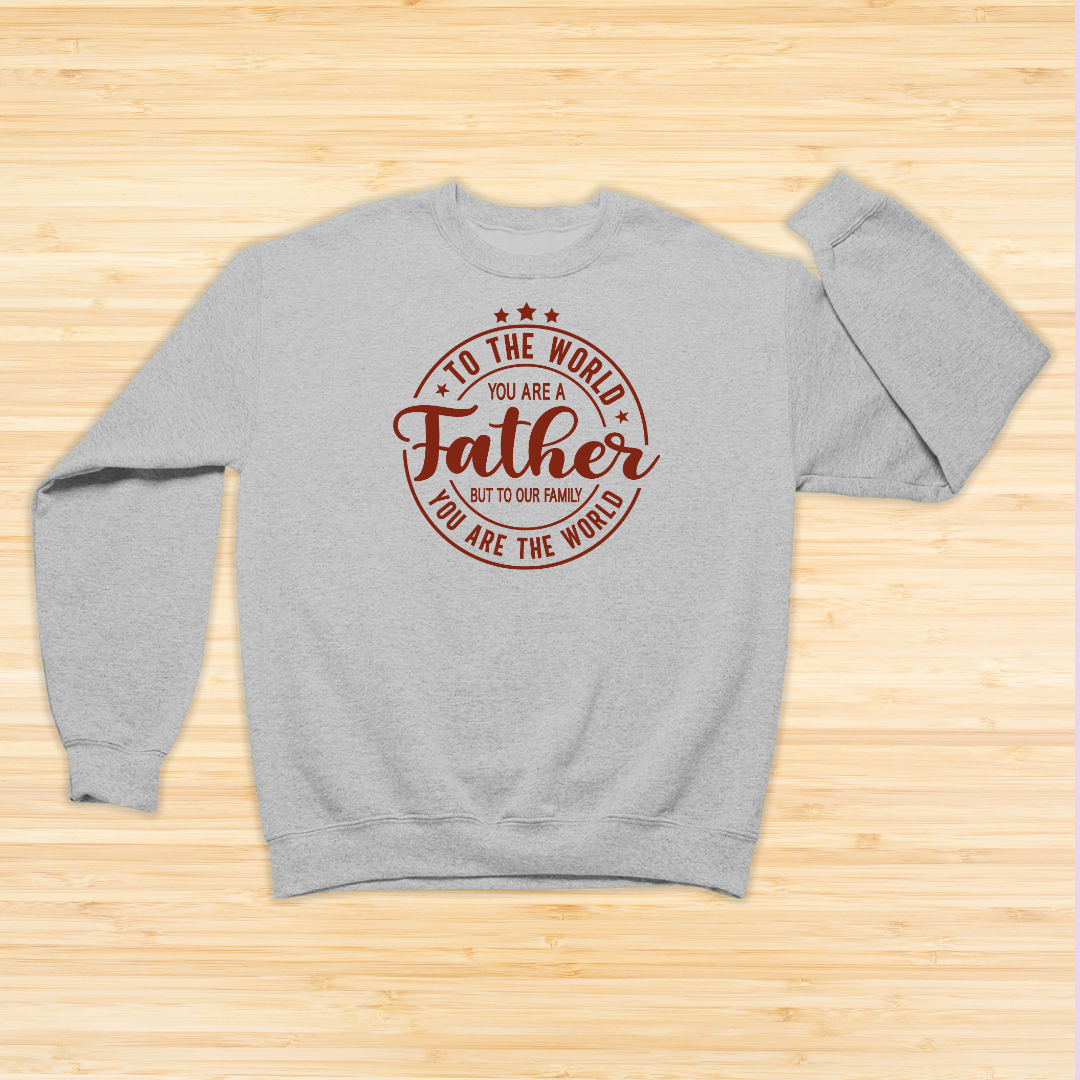 Gray sweatshirt with red text on a wooden surface