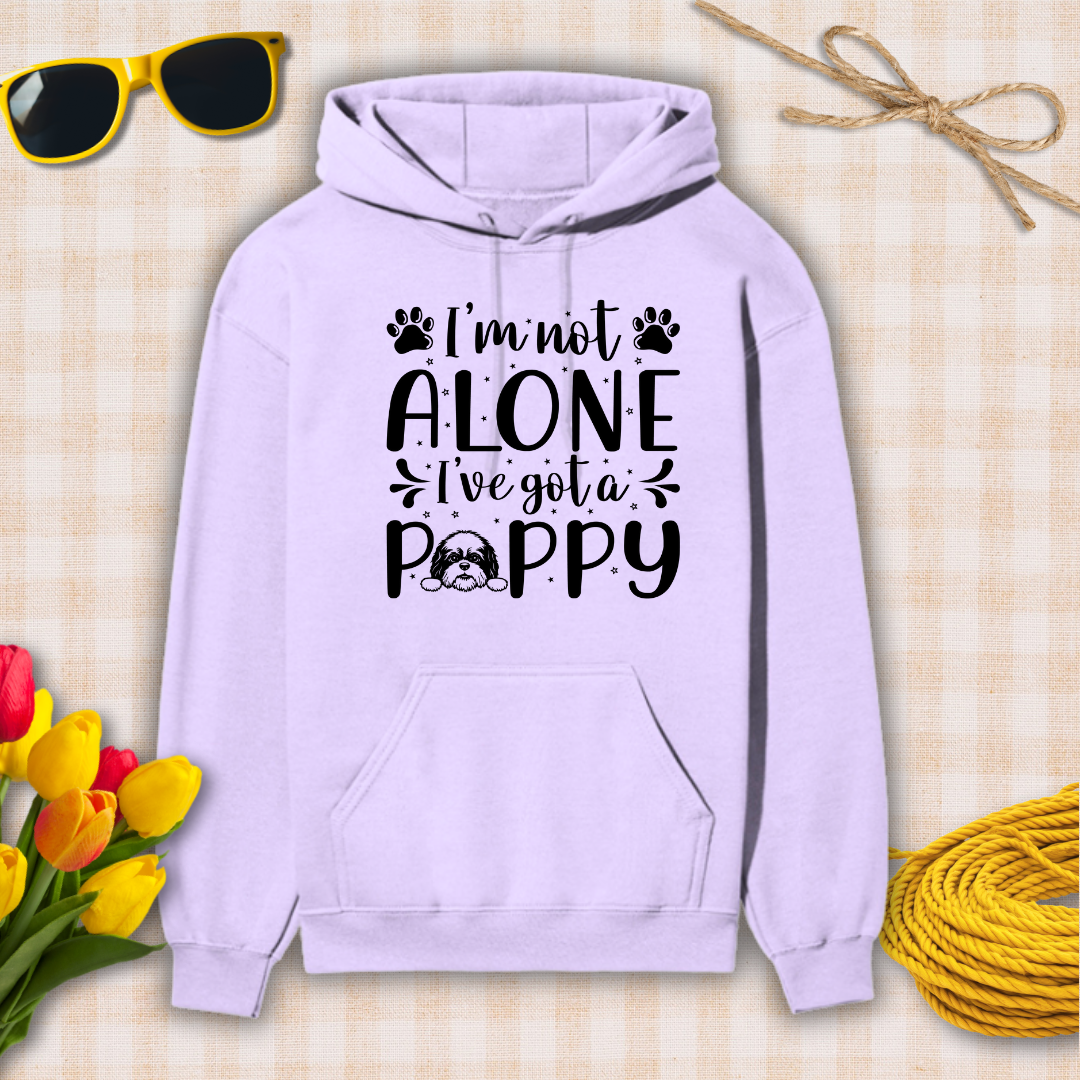 Lavender hoodie with 'I'm not alone, I've got a poppy' text on a textured surface with sunglasses, tulips, and twine.