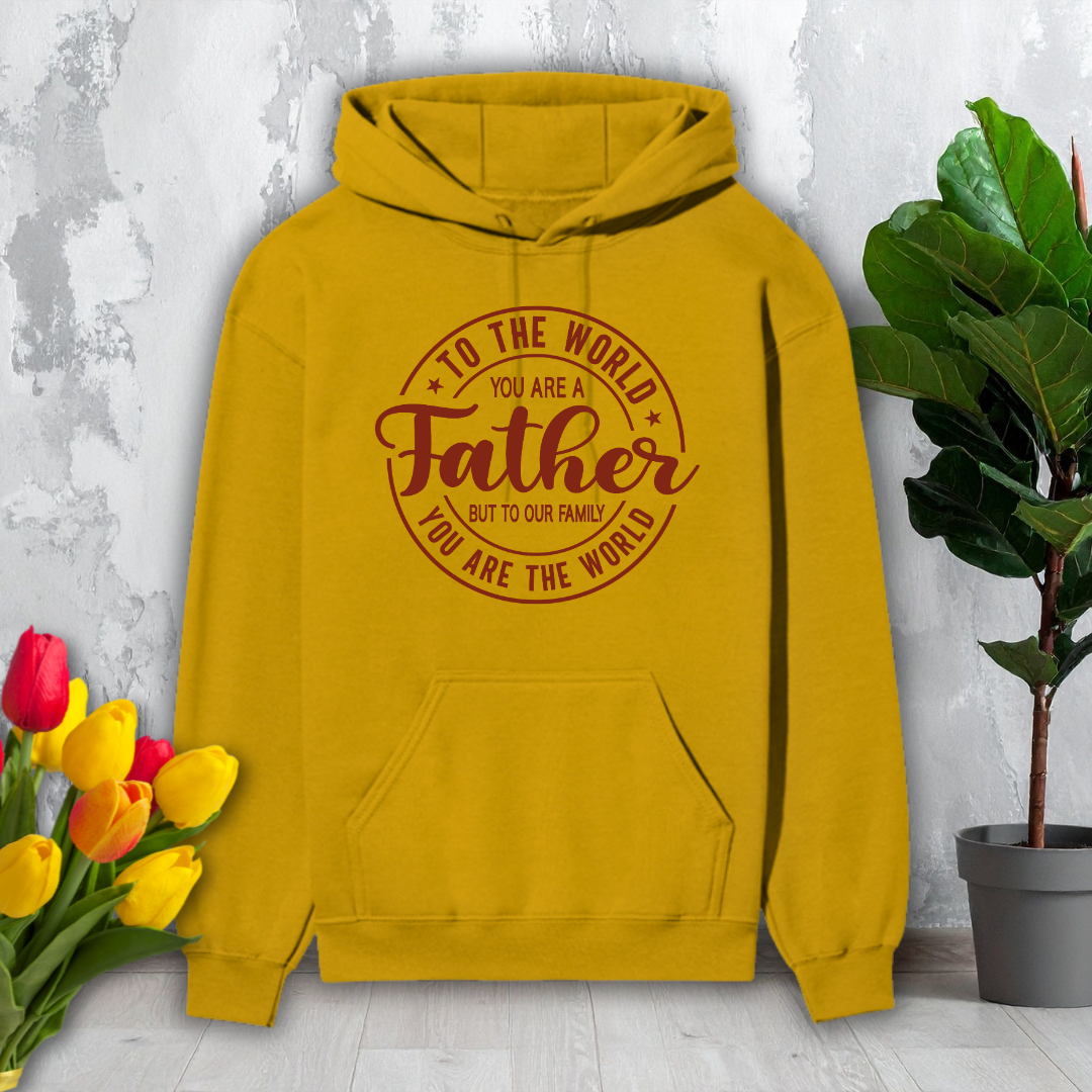 Yellow hoodie with text on a light gray background with flowers and a plant.