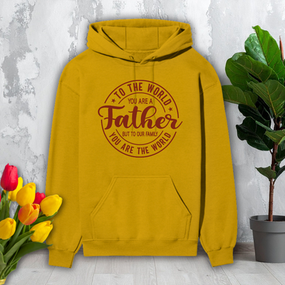 Yellow hoodie with text on a light gray background with flowers and a plant.