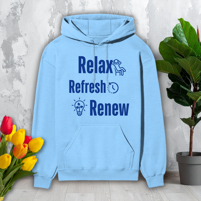 Light blue hoodie with motivational text on a gray surface with flowers and a plant.