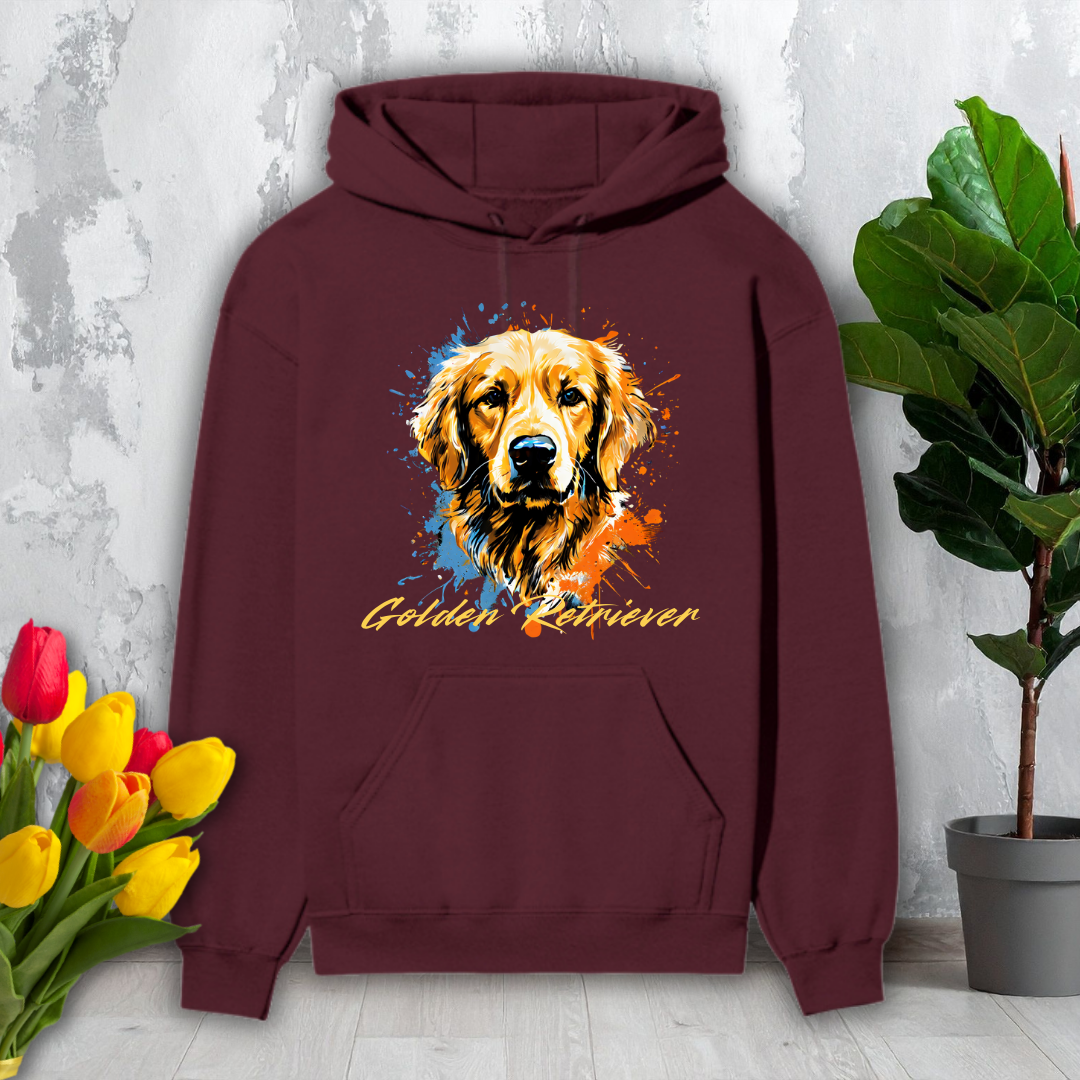 Maroon hoodie with a Golden Retriever design on a light gray surface with flowers and a plant.