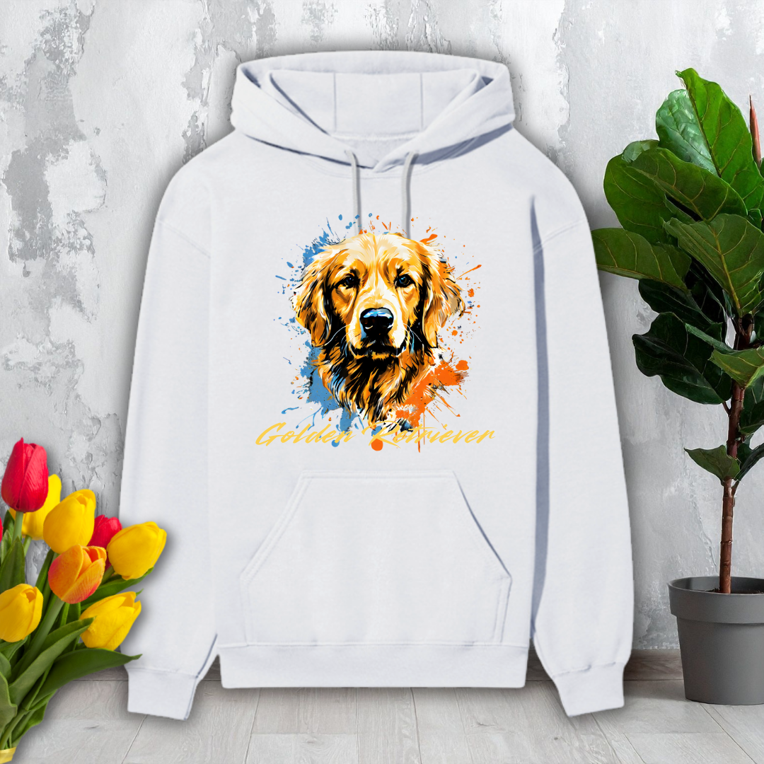 White hoodie with a colorful dog design on a light gray surface with flowers and a plant.