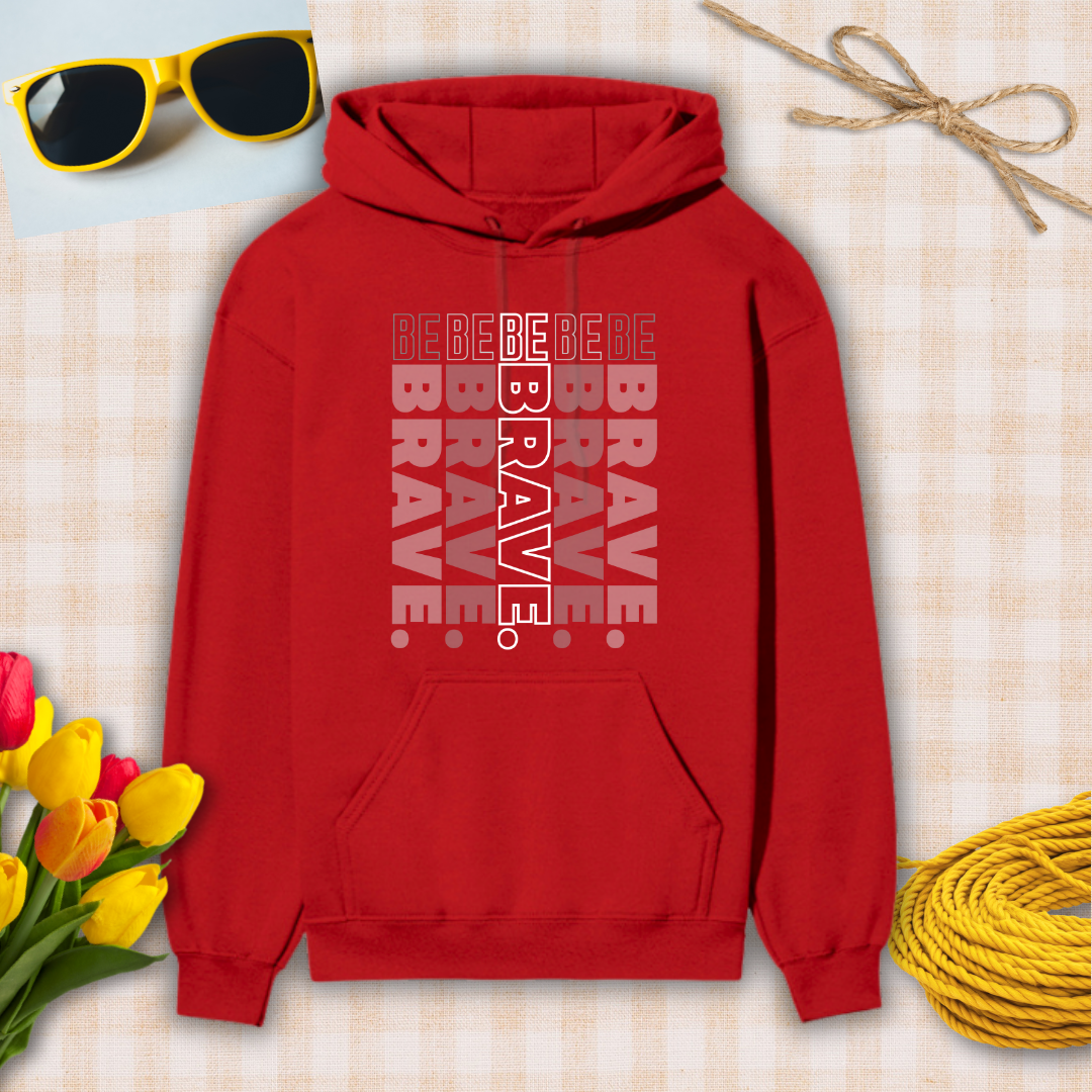 Red hoodie with 'BE BRAVE' text, sunglasses, flowers, and twine on a checkered background