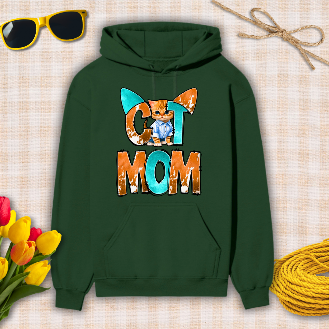 Green hoodie with 'Cat Mom' design on a checkered background with sunglasses, flowers, and yarn.