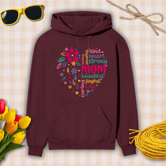 Maroon hoodie with colorful text and floral design on a checkered background with sunglasses, tulips, and twine.