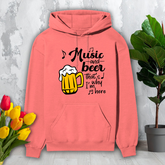 Coral hoodie with a graphic and text 'Music and beer that's why I'm here' on a light gray background.