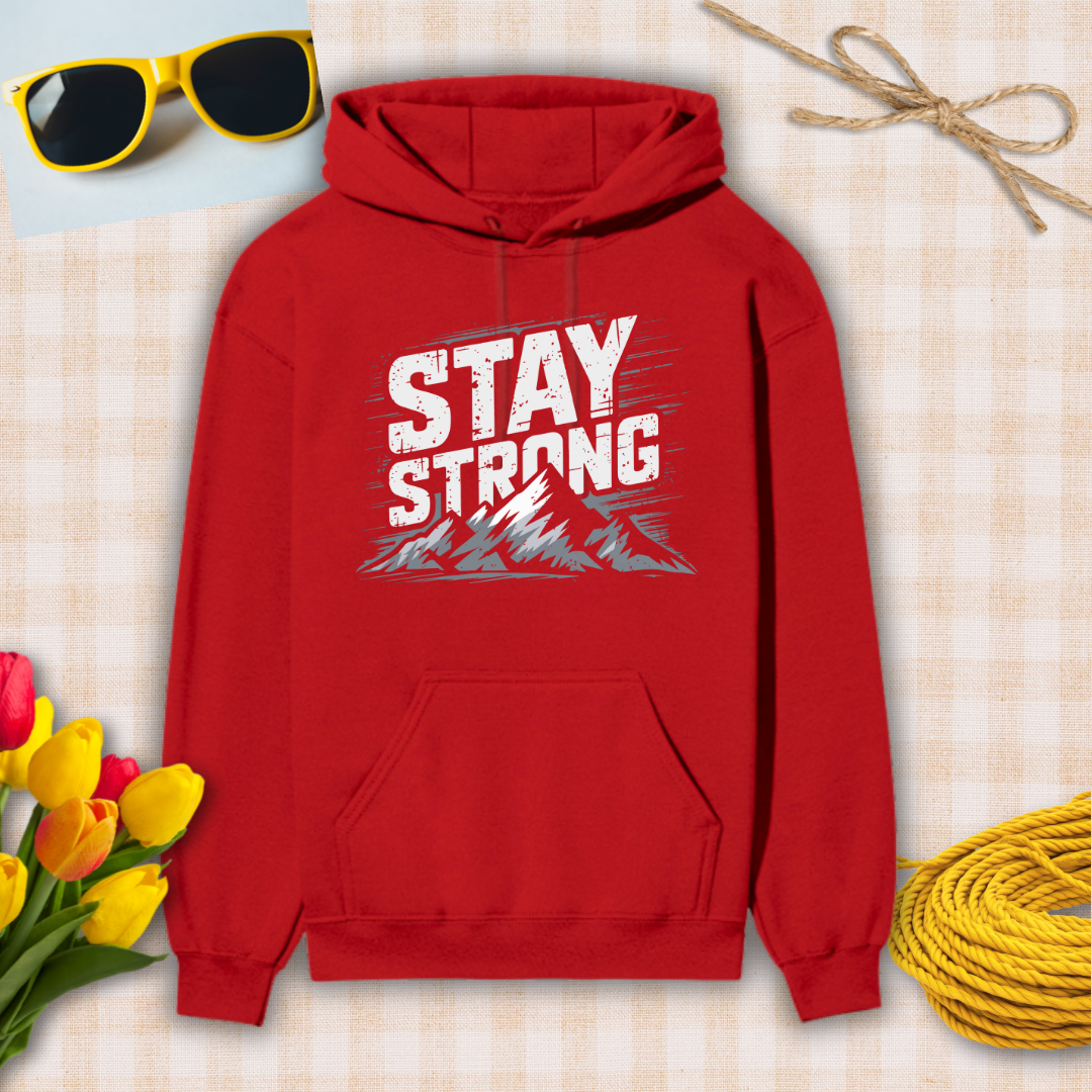 Red hoodie with 'Stay Strong' text on a checkered background with sunglasses, flowers, and twine.