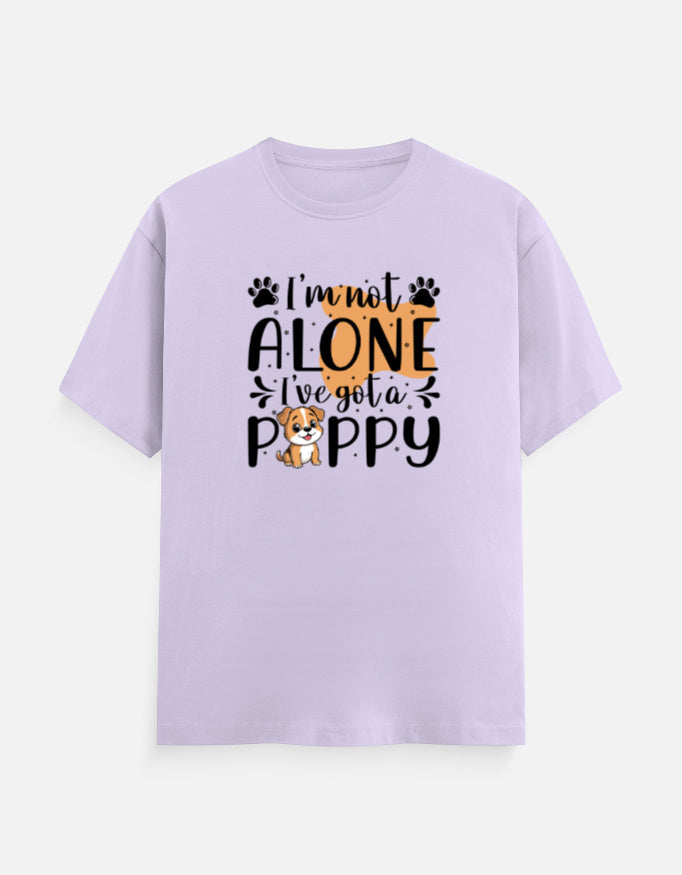 Cotton t-shirt with text 'I'm not alone, I've got a puppy' on a lavender background