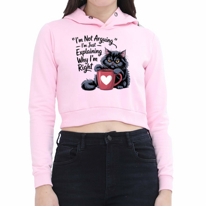 Pink hoodie with a graphic of a cat and text, worn by a person on a white background