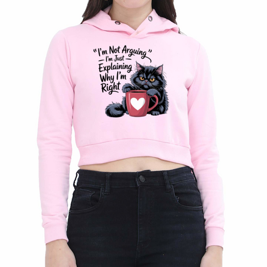 Pink hoodie with a graphic of a cat and text, worn by a person on a white background