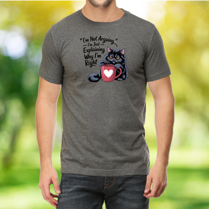 Person wearing a gray t-shirt with a graphic of a cat and text, against a blurred green and yellow background.