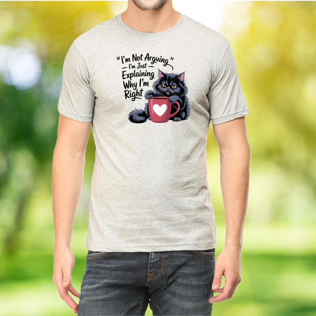 Person wearing a t-shirt with a cat graphic and text in a natural setting