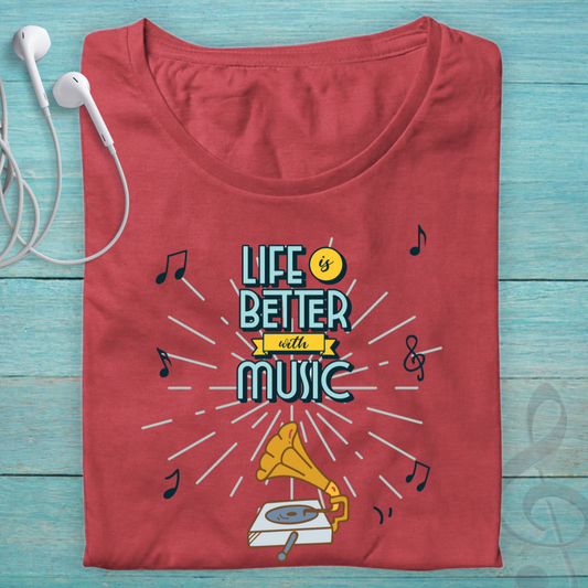 A folded red t-shirt with a retro graphic that reads 'LIFE IS BETTER with MUSIC' in teal and yellow, surrounded by musical notes and a gramophone illustration, displayed on a light blue wooden background with white earbuds.