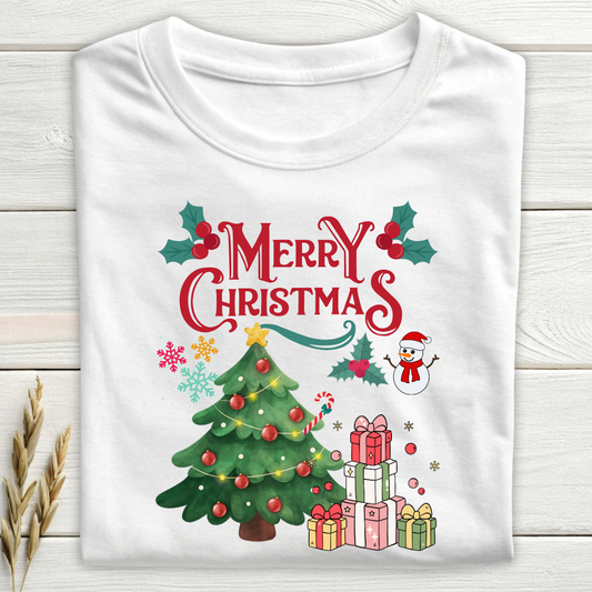 White t-shirt with Christmas-themed design featuring a tree, presents, and snowman on a wooden surface.