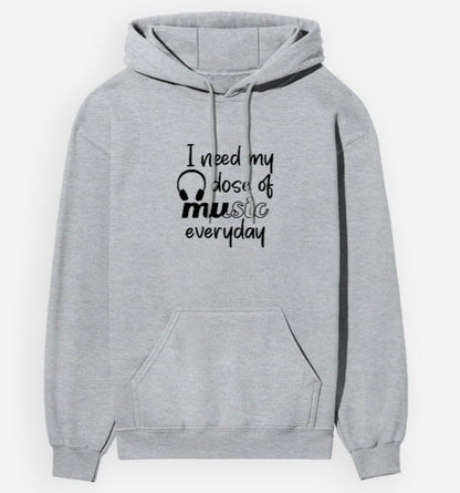Gray hoodie with text 'I need my dose of music every day' on a white background