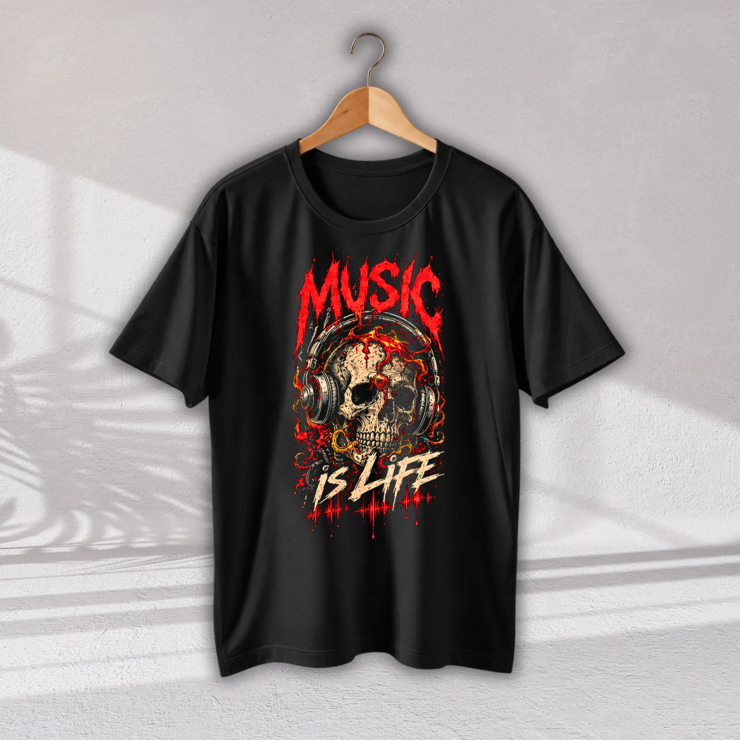 A black short-sleeve t-shirt hanging on a wooden hanger against a light gray wall. The shirt features a graphic print of a skull wearing headphones, with the words 'MUSIC IS LIFE' in red and white distressed lettering.