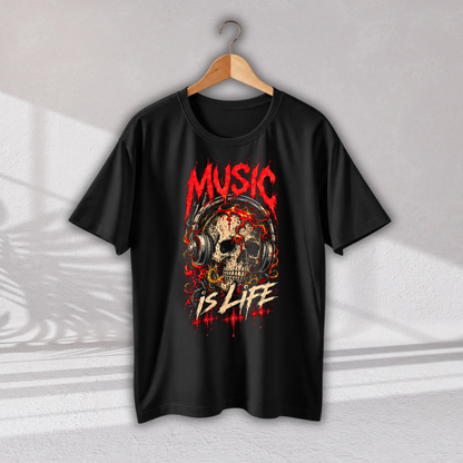 A black short-sleeve t-shirt hanging on a wooden hanger against a light gray wall. The shirt features a graphic print of a skull wearing headphones, with the words 'MUSIC IS LIFE' in red and white distressed lettering.
