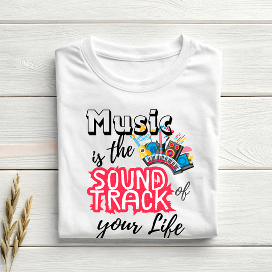 White t-shirt with musical design and text on a wooden surface