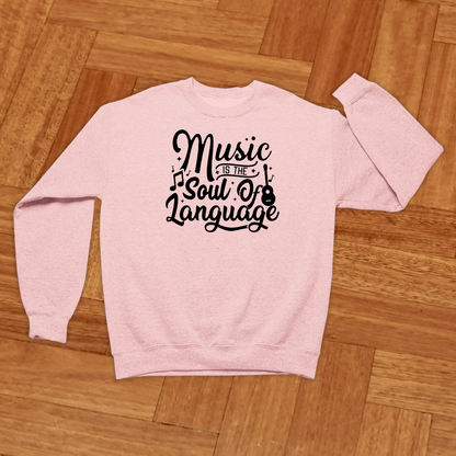 Pink sweatshirt with 'Music is the Soul of Language' text on a wooden floor