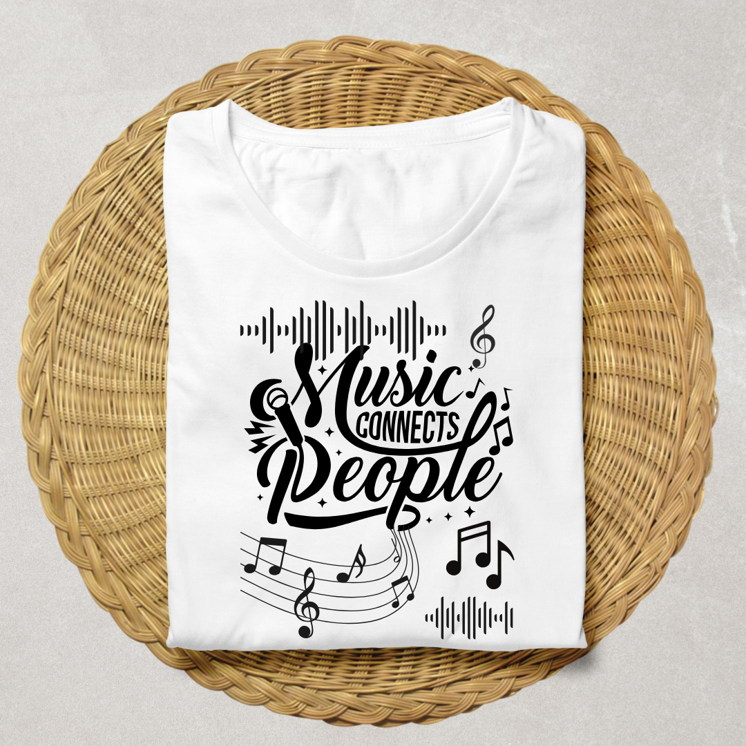 A folded white T-shirt with a black graphic reading 'Music Connects People' surrounded by musical notes and staff lines, displayed on a round woven wicker tray against a light neutral background.