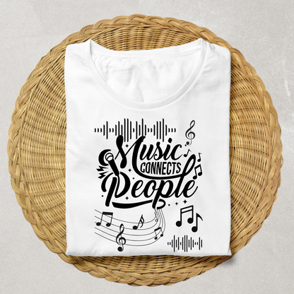A folded white T-shirt with a black graphic reading 'Music Connects People' surrounded by musical notes and staff lines, displayed on a round woven wicker tray against a light neutral background.