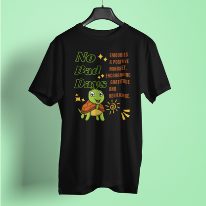 Black t-shirt with a turtle graphic and motivational text on a light green background