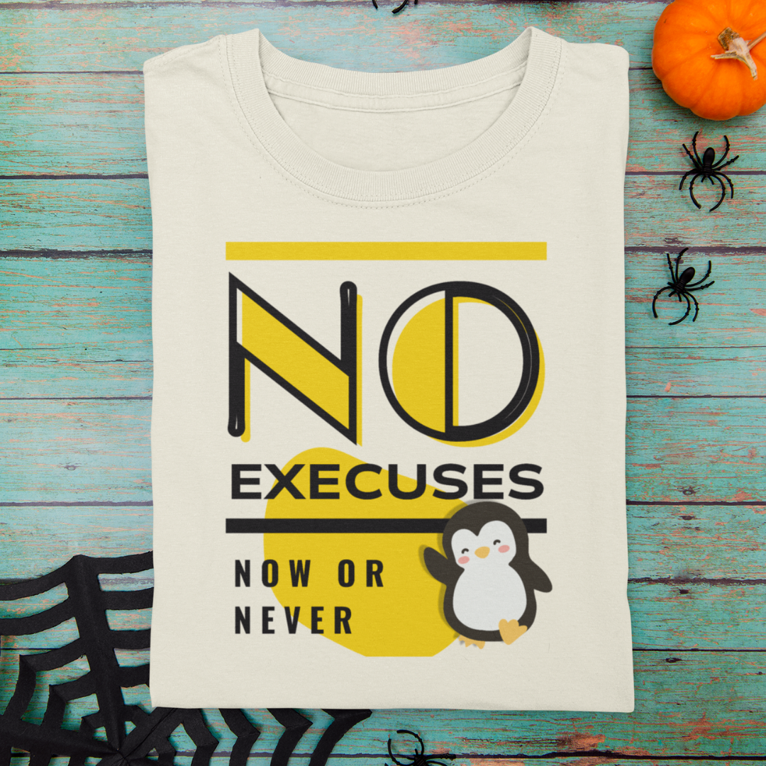 Beige t-shirt with penguin graphic and text on a wooden surface with Halloween decorations.