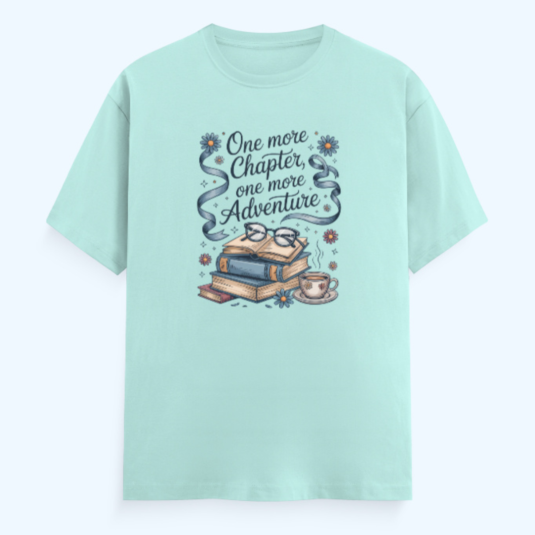 Mint green t-shirt with book-themed design and text on a light blue background
