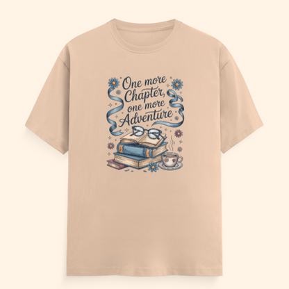 Beige t-shirt with book-themed graphic and text on a beige background