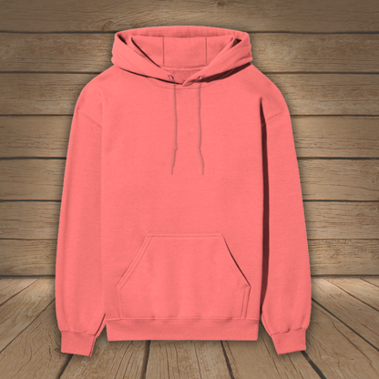 Coral hoodie on a wooden background