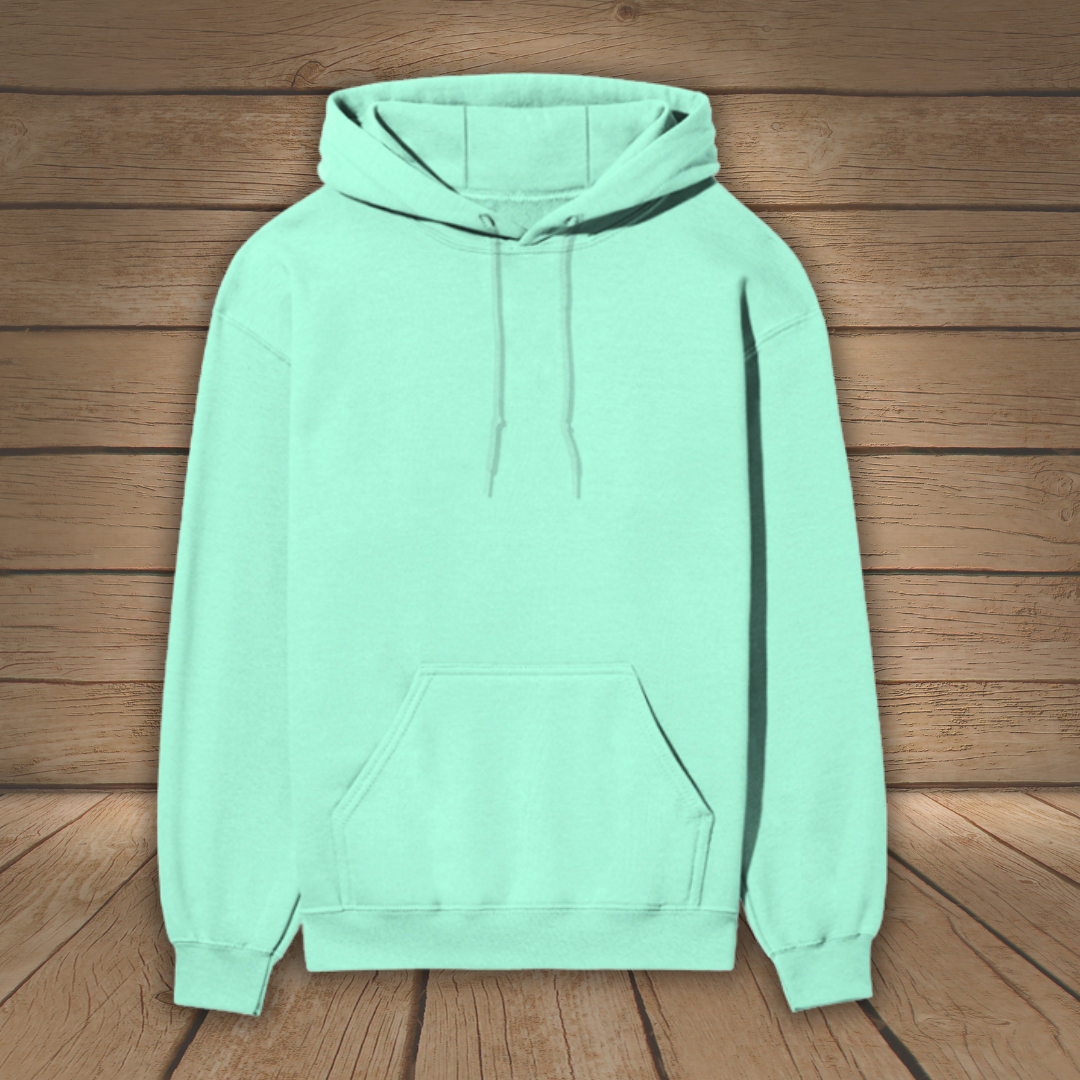 Mint green hoodie on a wooden surface